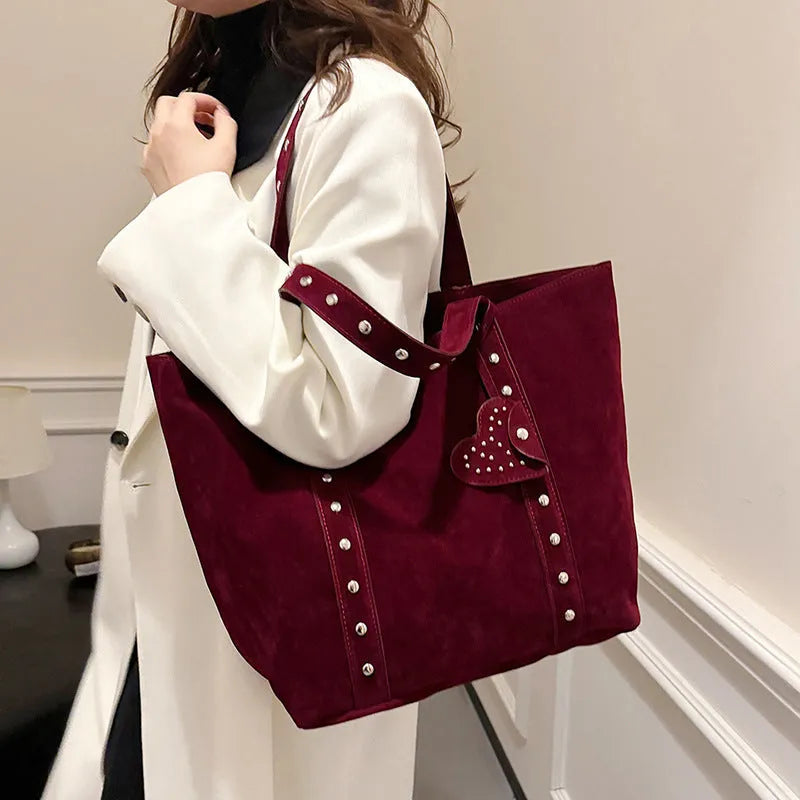 Women's black PU leather tote bag with double shoulder straps showing sandwich pocket detail