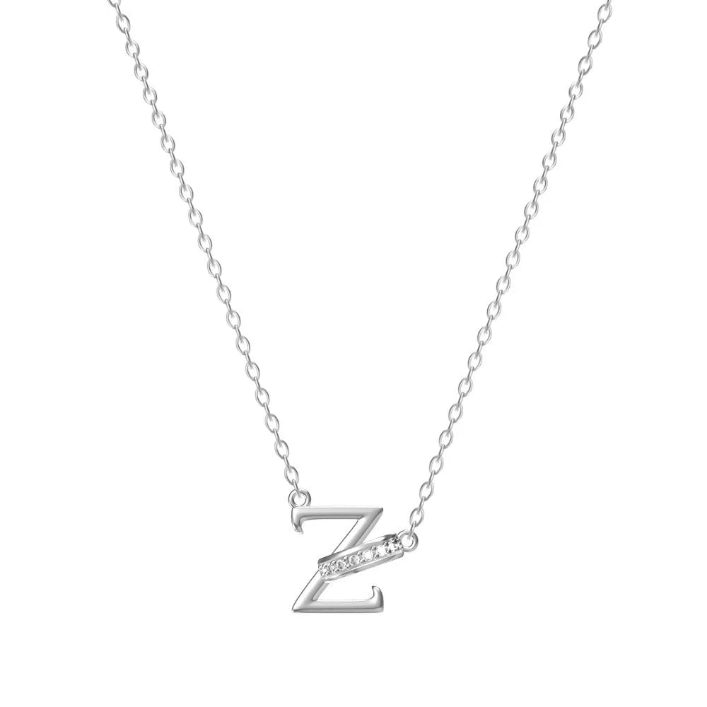 Women's 26-letter initial necklace in titanium steel with a round zircon pendant on a cross chain, colour option shown