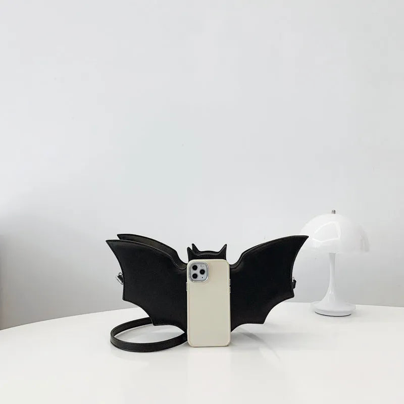 Black PU Halloween bat shaped shoulder messenger bag with crossbody strap on white background