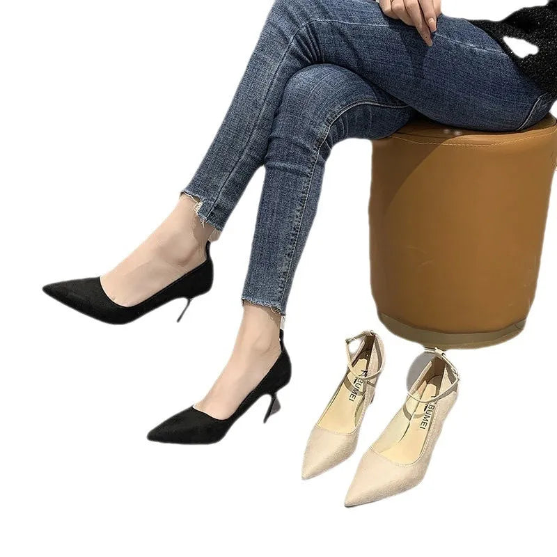 Women's black and creamy white stiletto heel pump shoes with an ankle buckle, shown in 5cm and 8cm heel heights.