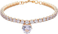 Gold heart-shaped rhinestone dog collar on a white background, showing shiny bling design.