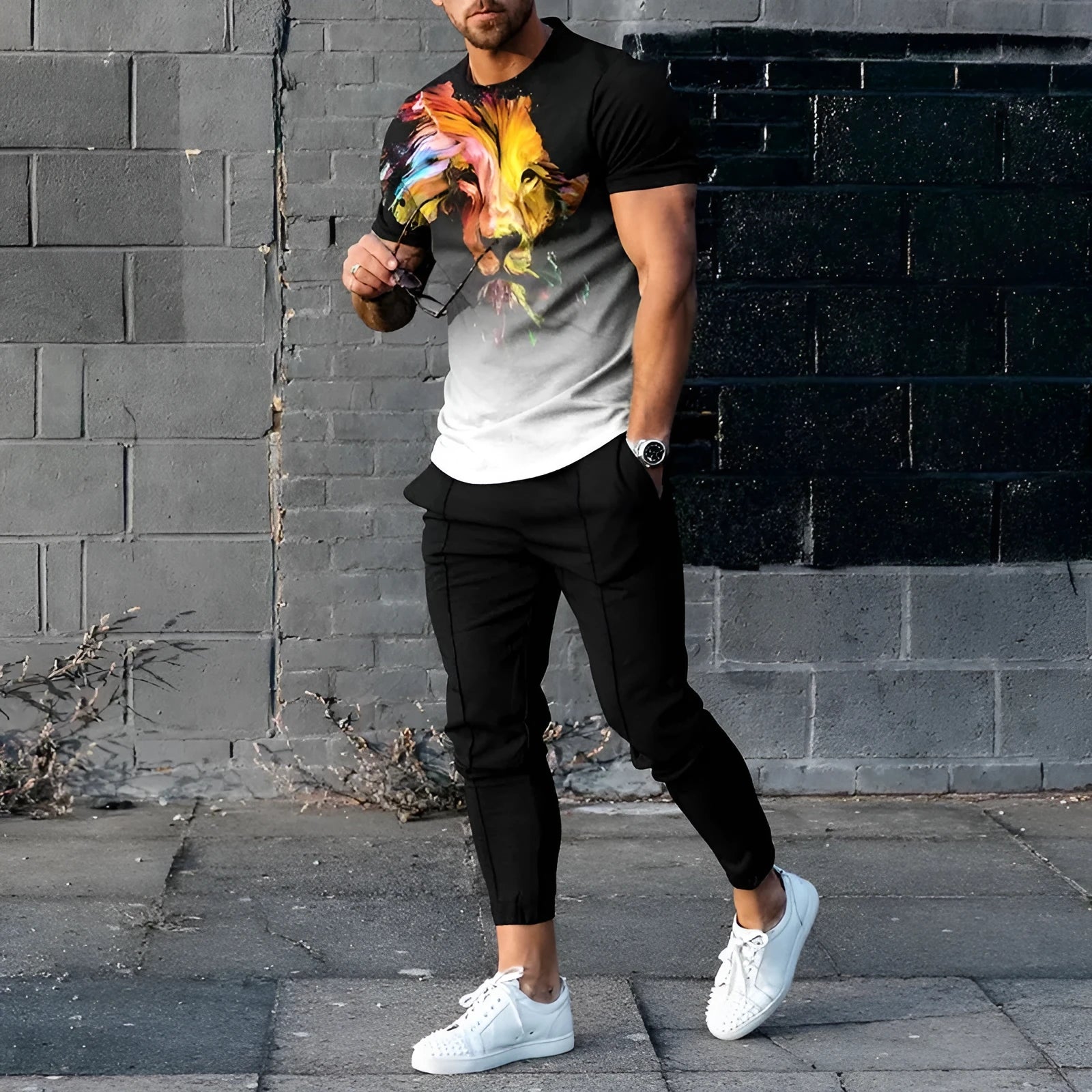 Men's casual printed short sleeve pullover and matching trousers suit set on a white background.