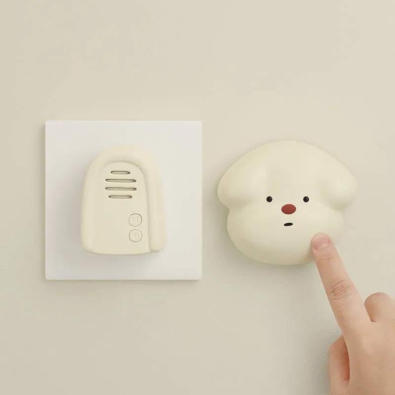 Wireless plug-in doorbell in milky yellow or white colour for household use