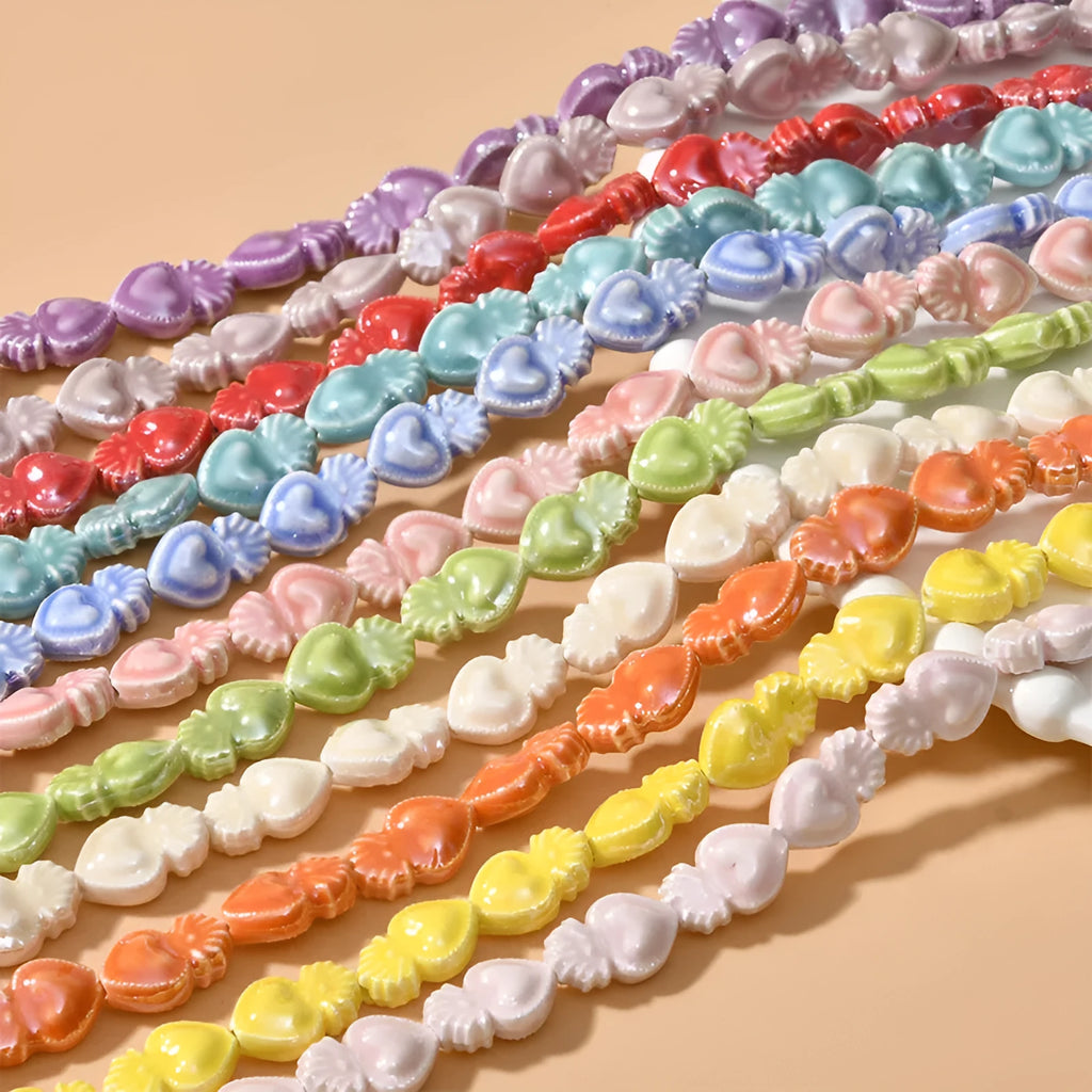Ceramic love heart small torch shaped beads in various colours with straight holes for jewellery making
