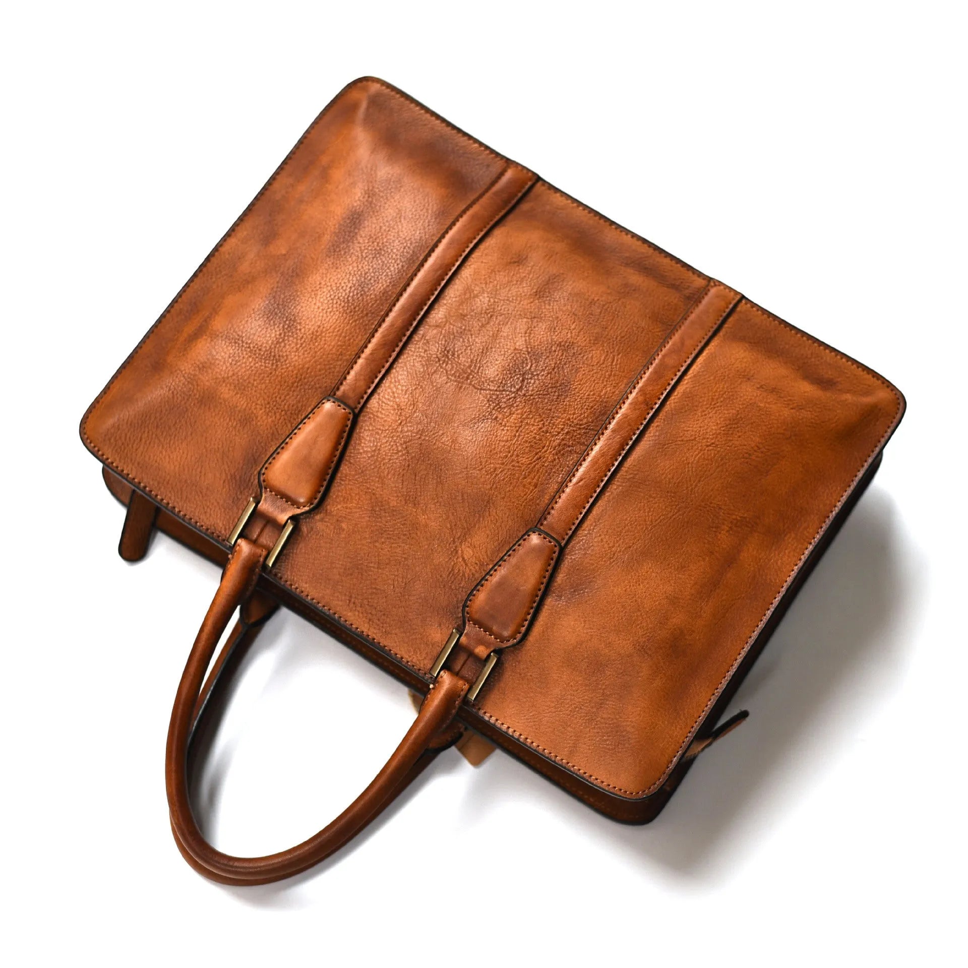 Men's brown leather horizontal business handbag with zippered closure on wooden surface
