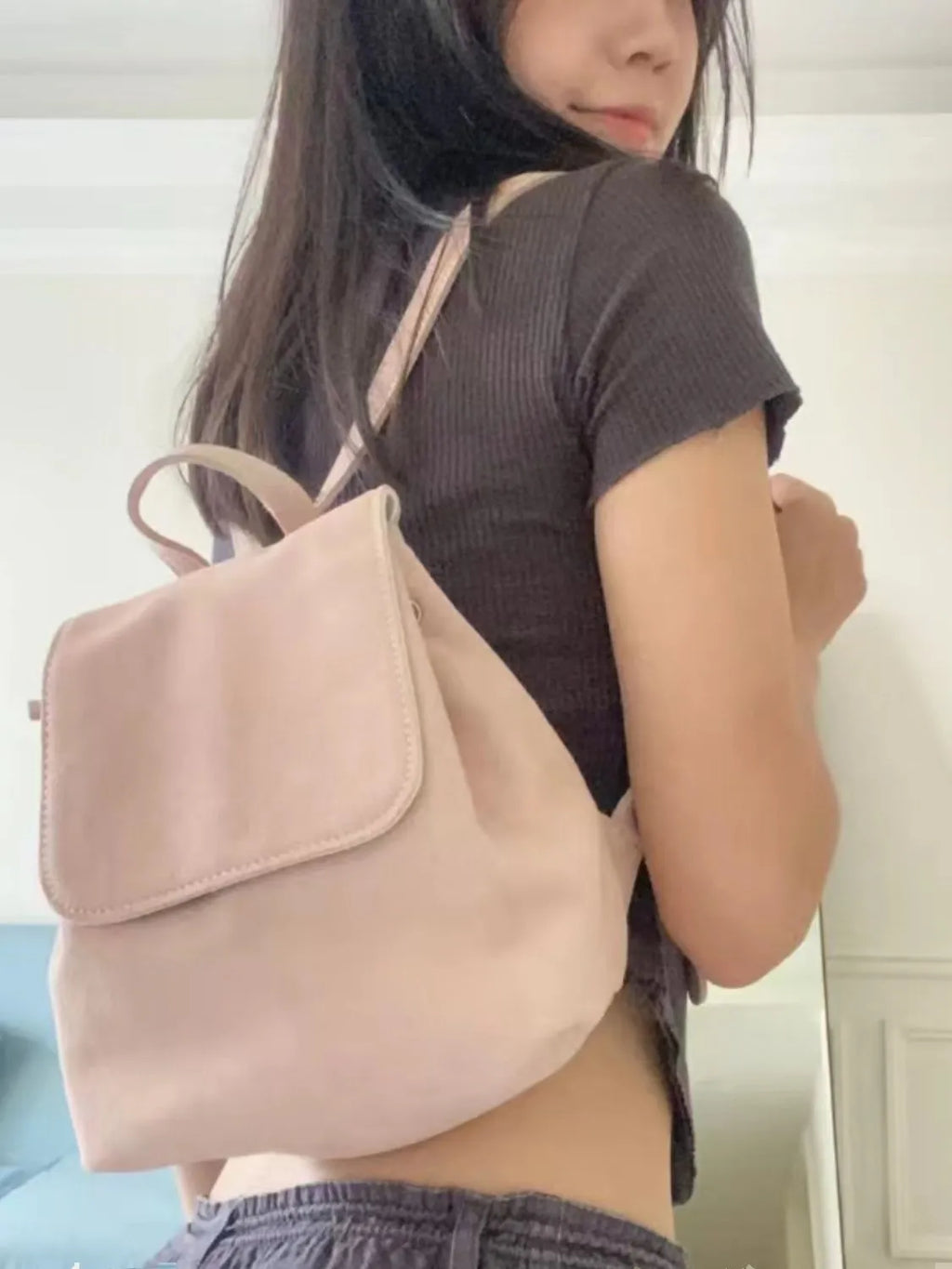 Retro suede girls backpack in brown with shoulder strap and sewing thread detailing