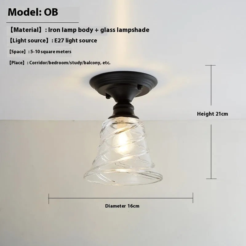 American retro single-head ceiling lamp with clear glass shade showing exposed filament style