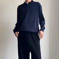 Man wearing a milky white pure wool polo collar sweater with a lapel design.