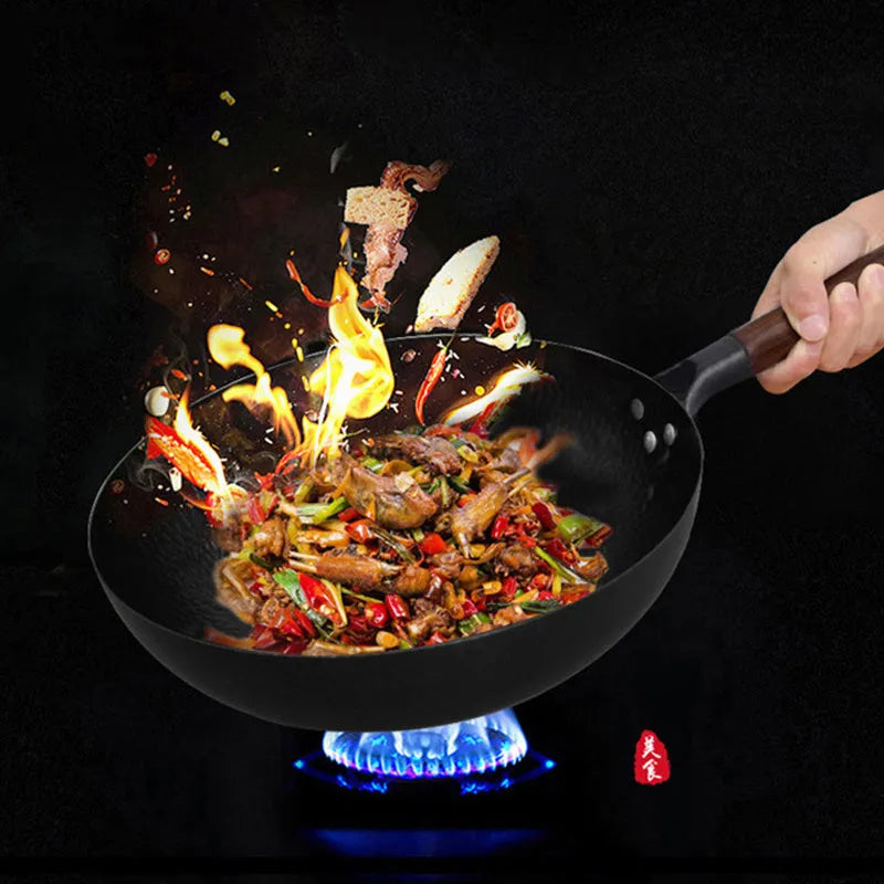 Traditional black iron wok with long wooden handle, 32cm cooking surface