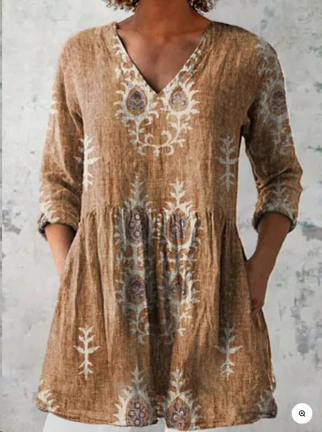 Women's loose-fitting long dress with a blue wave pattern print and 3/4 sleeves.