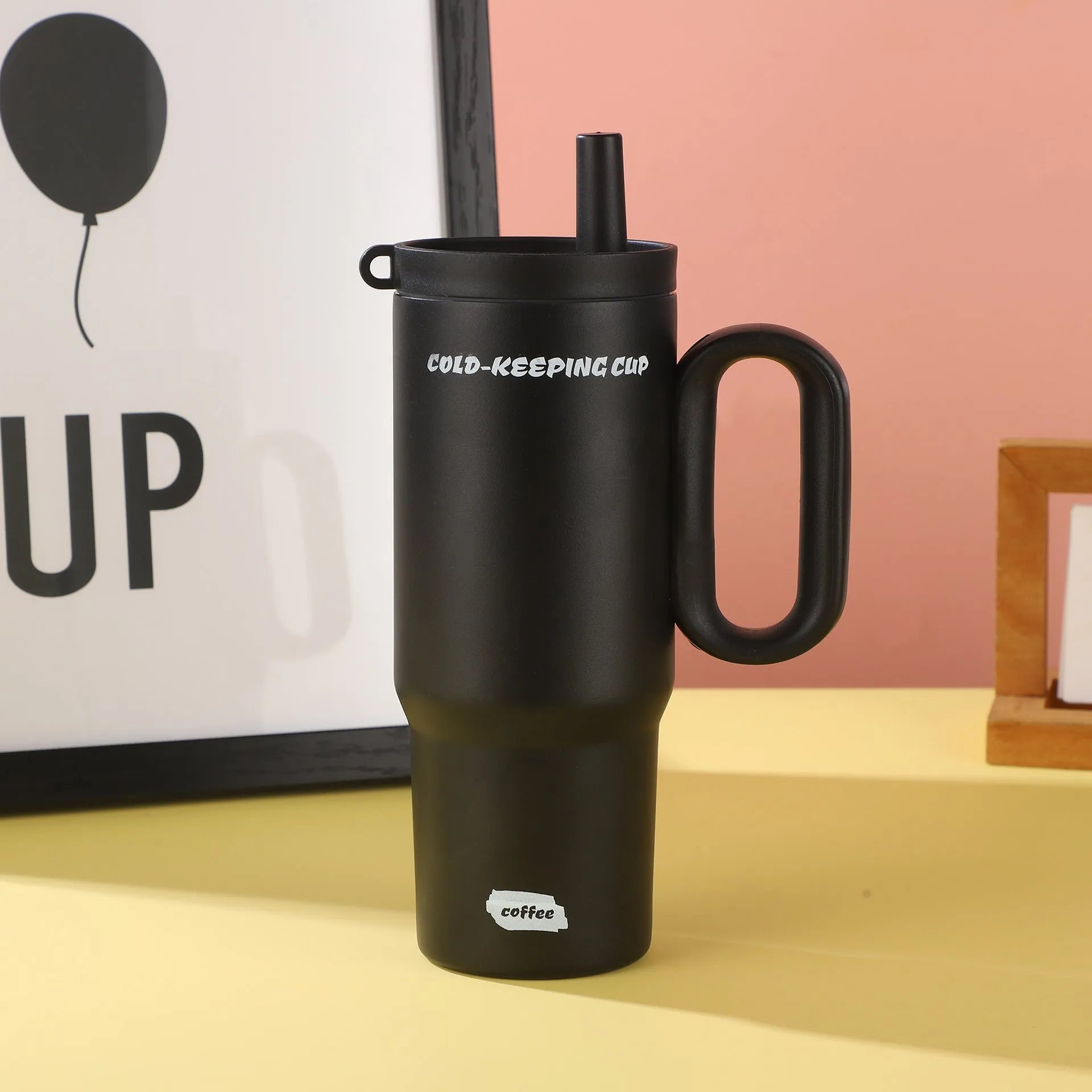 Insulated plastic straw cup with carry handle in five colour options showing 700ml capacity