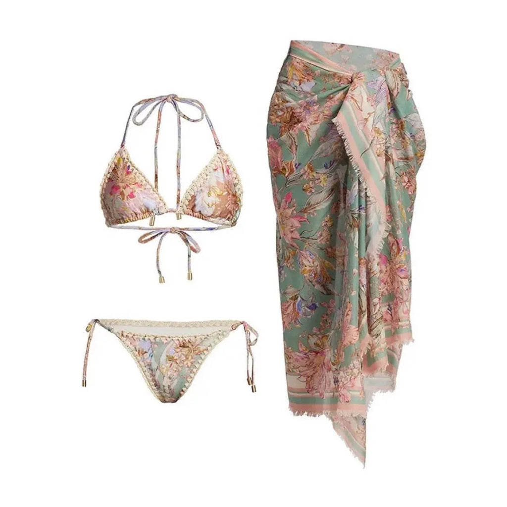 Creamy white floral print women's bikini set with attached skirt, showing top, briefs, and skirt components