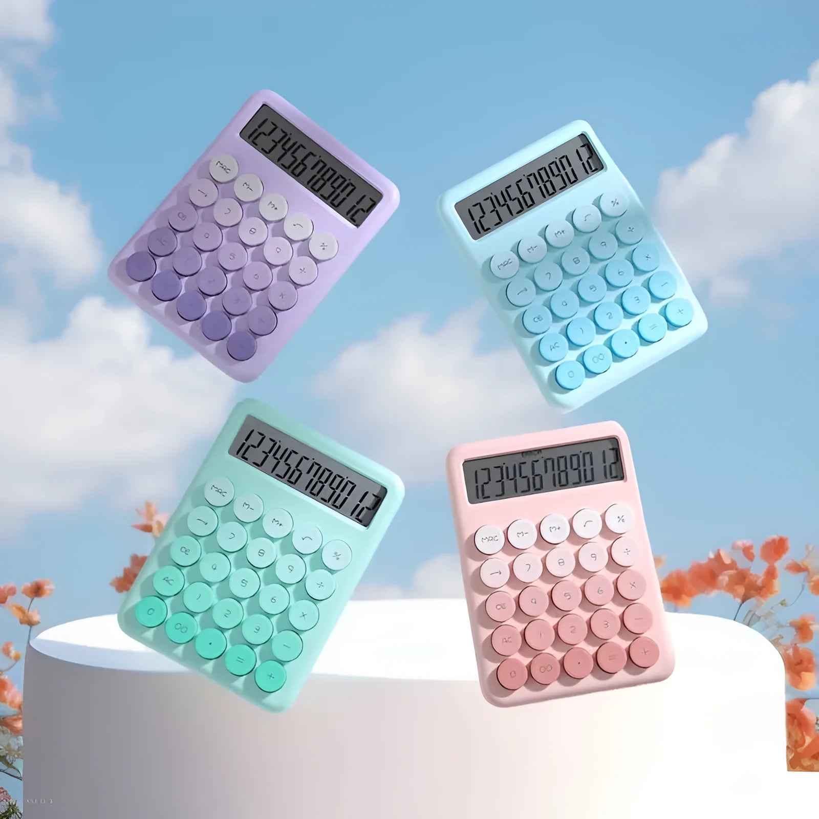 12-digit gradient colour desktop calculator in violet, blue, green, or pink on a desk