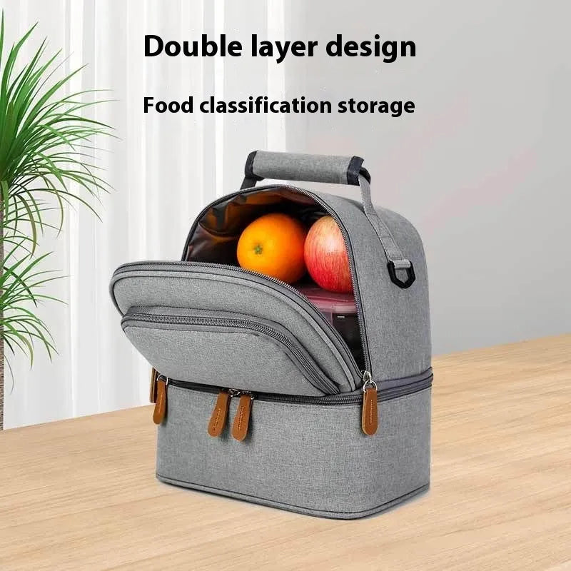 Grey women's thermal insulation backpack made of Oxford cloth with a curved shoulder strap.