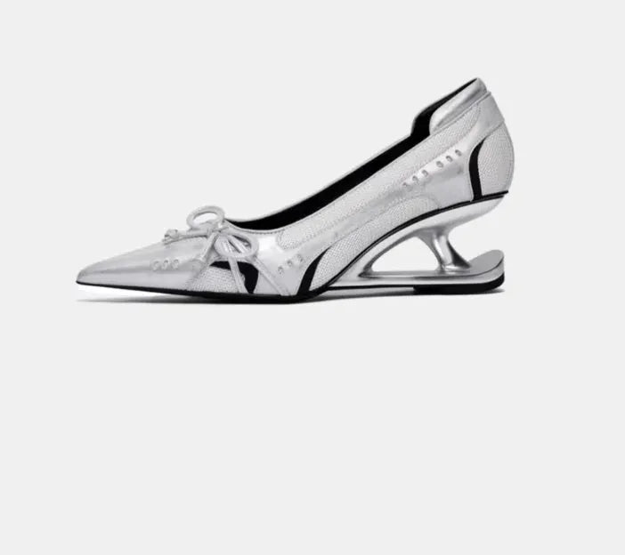 Women's black pointed toe Mary Jane shoes with floating heel design and slip-on closure