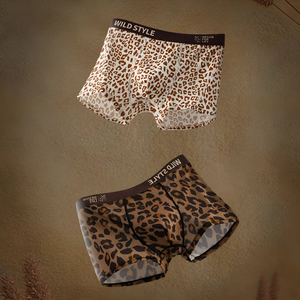 Men's leopard print ice silk boxer shorts laid flat, showing mid-waist design and polyester fabric.