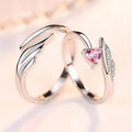 Silver adjustable heart diamond ring with geometric design on a plain background