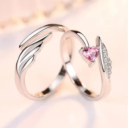 Silver adjustable heart diamond ring with geometric design on a plain background