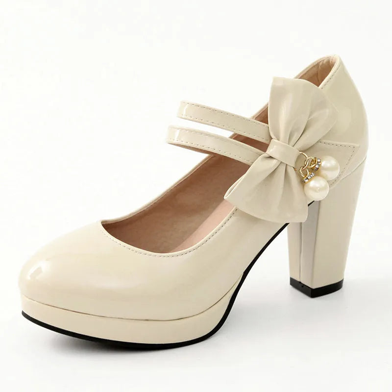 Women's red chunky heel platform shoes with round toe and buckle fastening on a rubber sole.