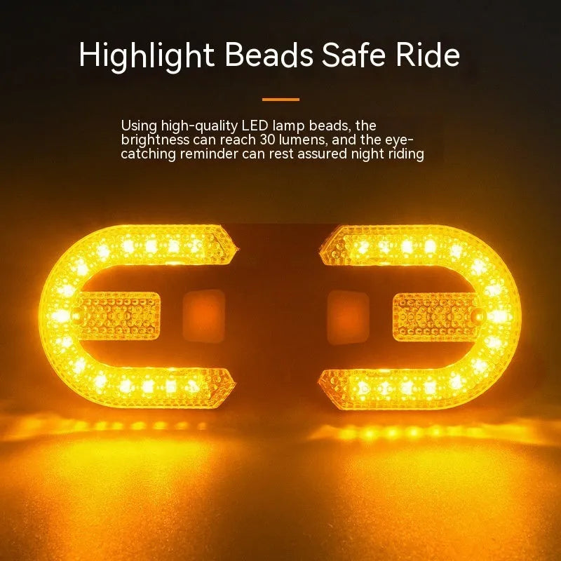 Black wireless remote control bicycle taillight with turn signals and USB charging cable