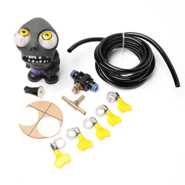 Turbo car explosive eye doll ornament and pressure valve kit with copper fittings on a white background.