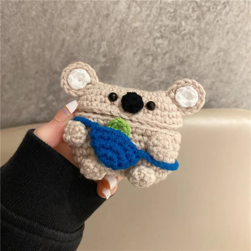 Handmade knitted grey koala bear backpack design cover on an Apple AirPods Pro charging case.