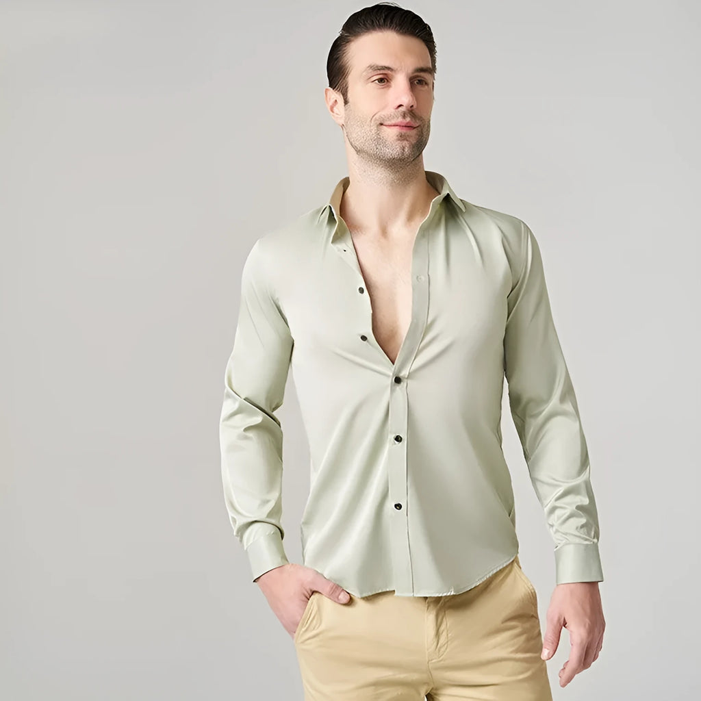 Man wearing a solid-colour stretch long sleeve work shirt made from polyester fabric.