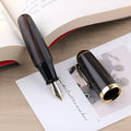 Solid wood short chubby ink pen with fine tip on wooden surface