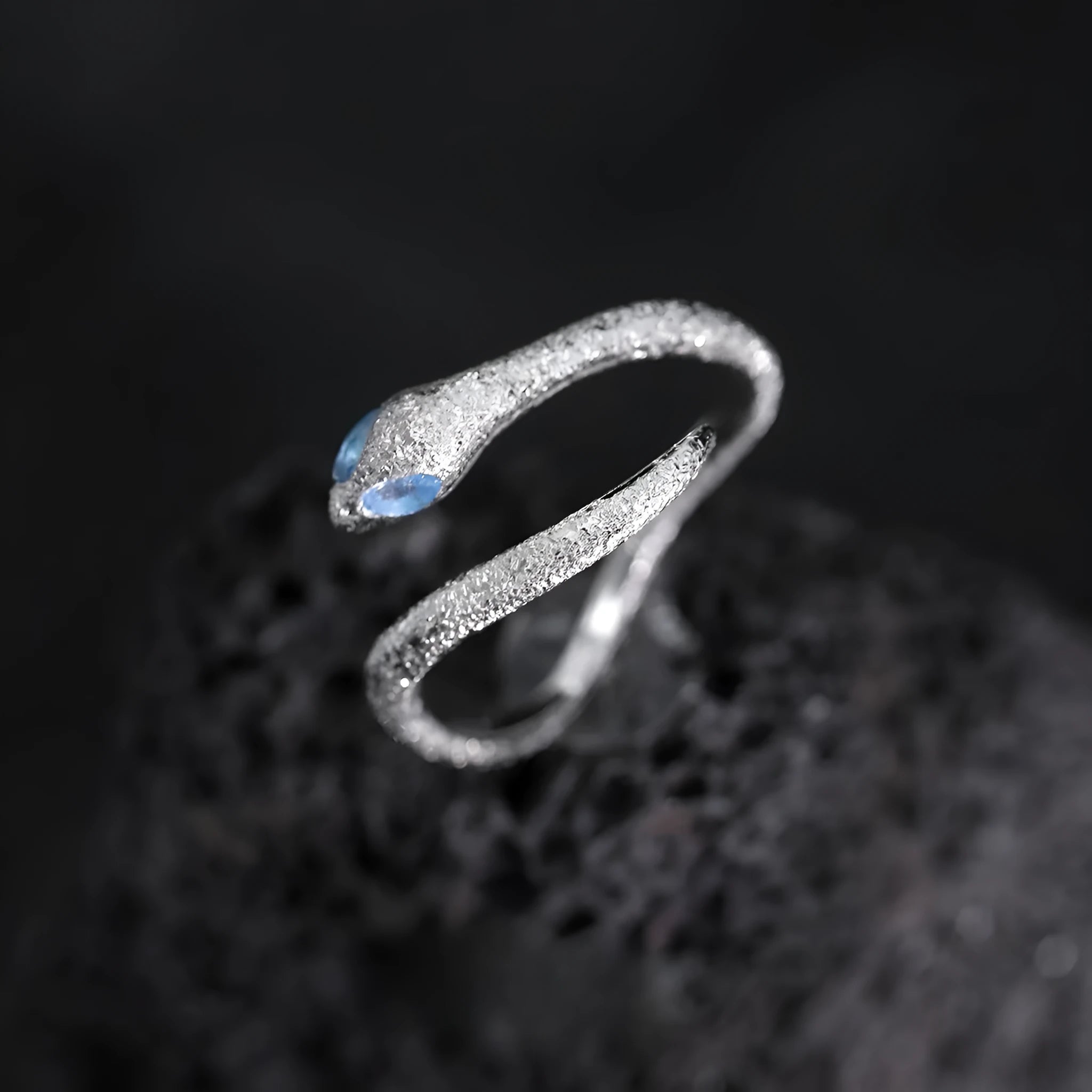Adjustable silver snake ring with electroplated white gold finish and zodiac design