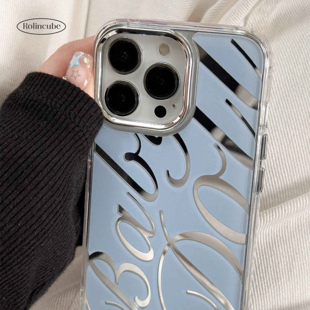 Transparent blue iPhone case with mirrored surface showing JMKJ letters, compatible with Apple models 11 to 16 Pro Max