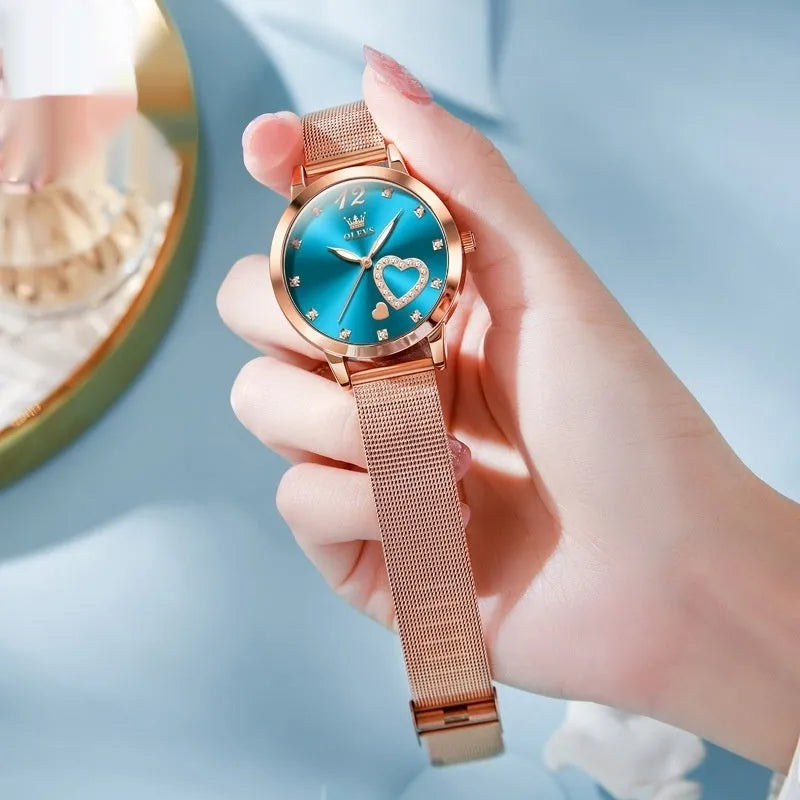 Women's fashion watch with rose gold tone alloy case and mesh strap in six dial colour options.