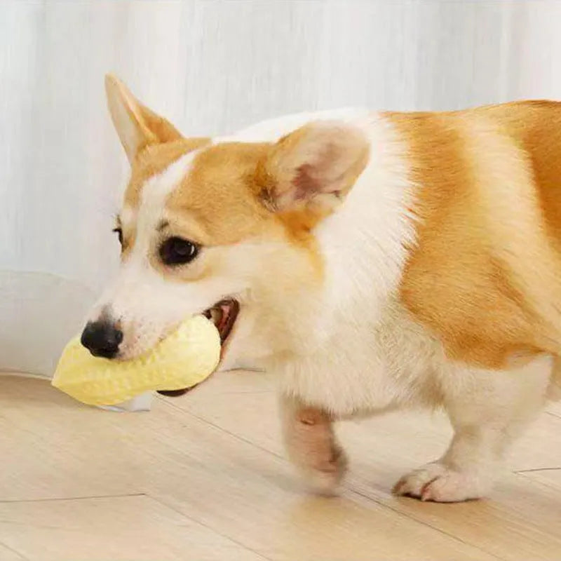 Yellow peanut-shaped dog chew toy with textured surface for dental cleaning