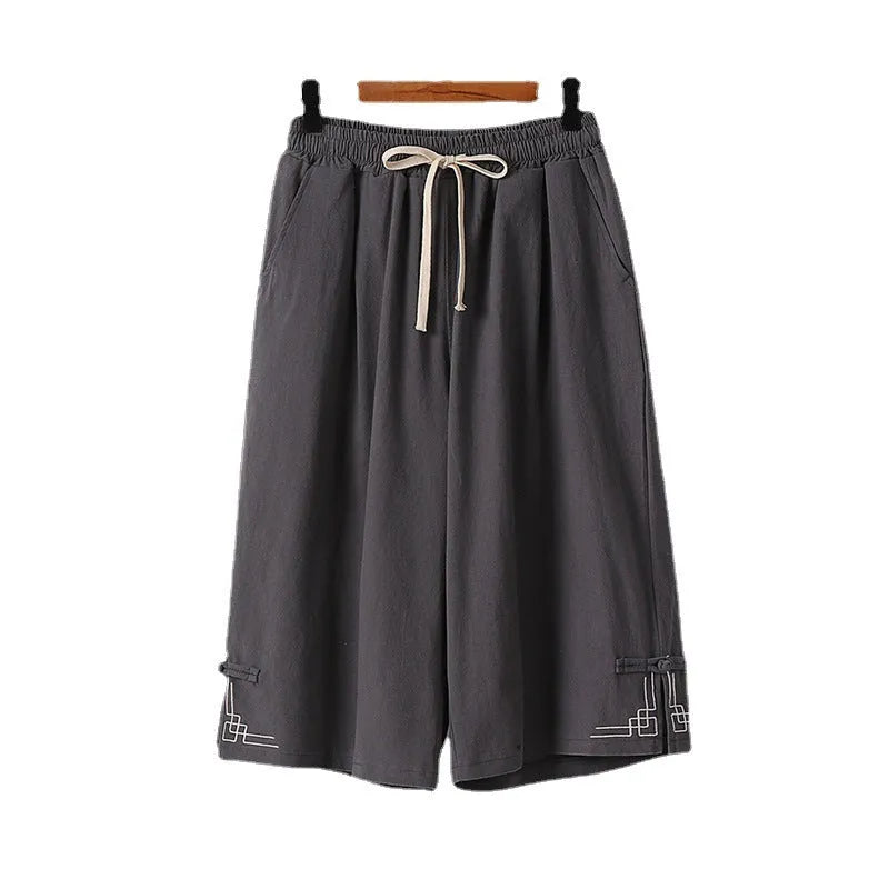 Apricot wide leg cotton leisure shorts with embroidery detail on a mid waist.
