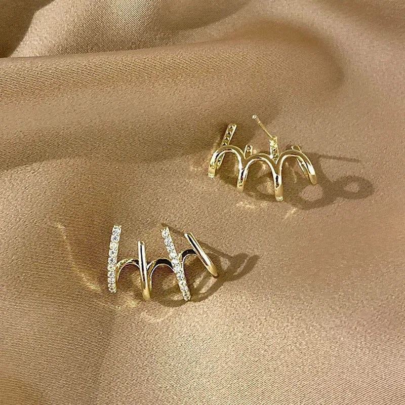 Pair of S925 silver needle four-prong zircon inlaid geometric stud earrings in gold finish