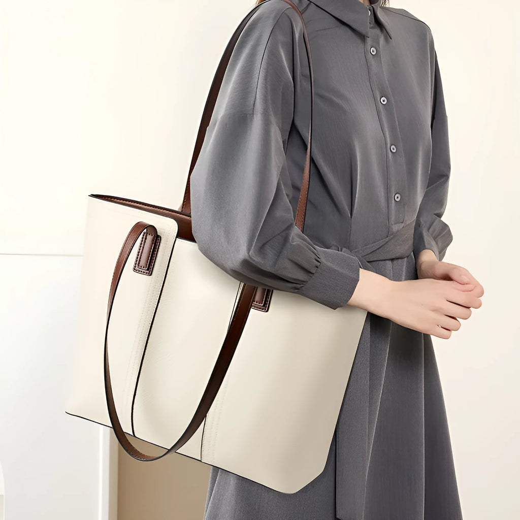 Women's black genuine leather crossbody bag showing horizontal square shape and internal organiser pockets