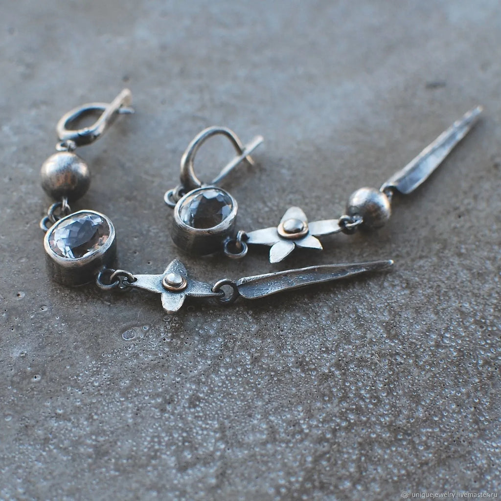 Geometric XINGX pendant earrings in antique silver with rhinestone detailing