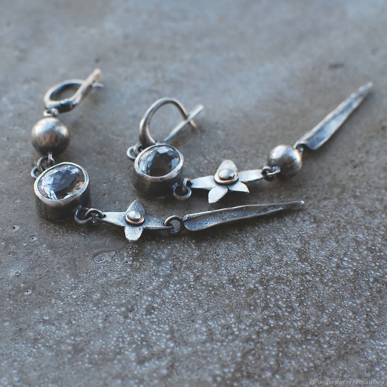 Geometric XINGX pendant earrings in antique silver with rhinestone detailing