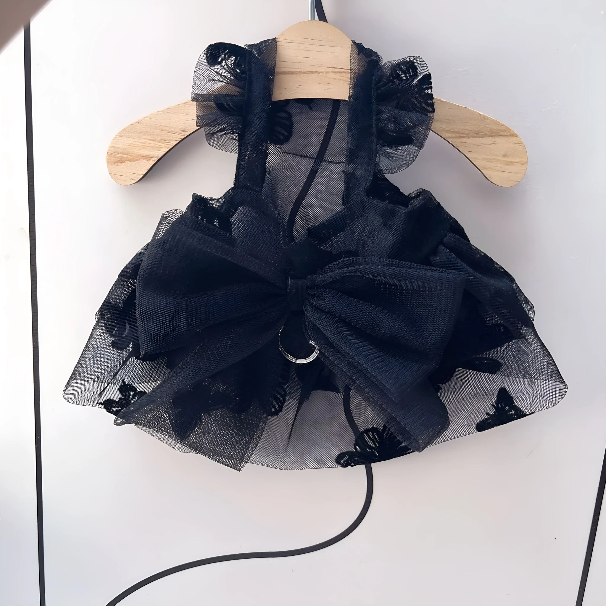 Black polyester princess tulle skirt for a small dog or cat on a white background.