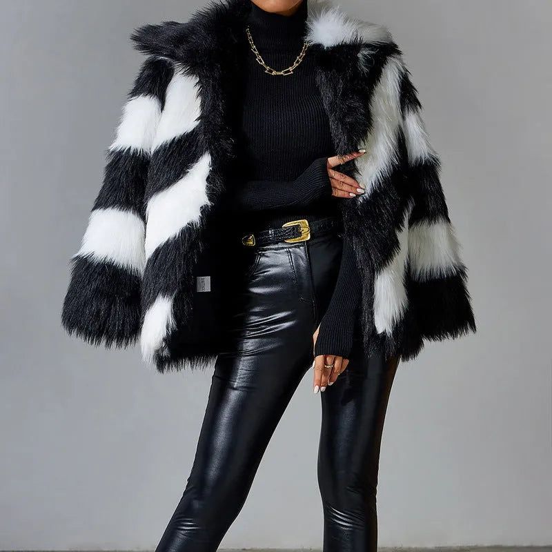A minimalist faux fur coat with contrast lapels and a detachable fur collar, shown in picture colour.