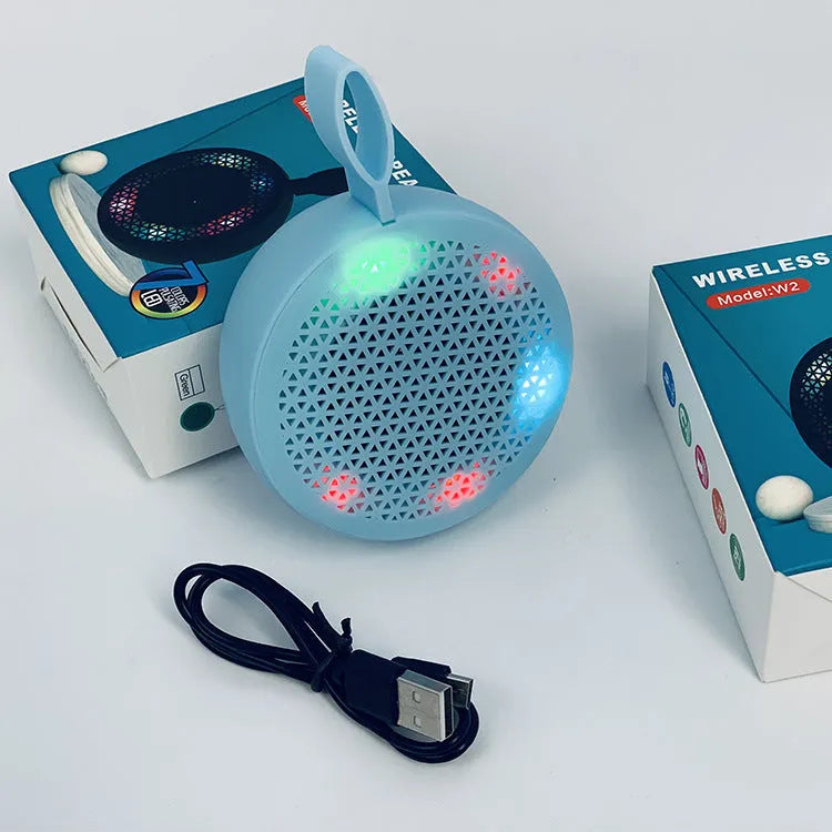 Pink mini Bluetooth speaker with plastic shell and button controls, 82x82x40mm