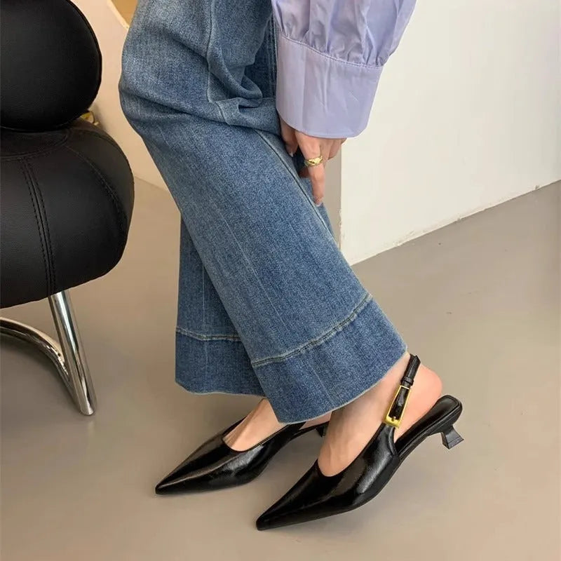 Thin low heel strap pointed leather shoes in black, red, brown, and silver colour options showing rubber soles