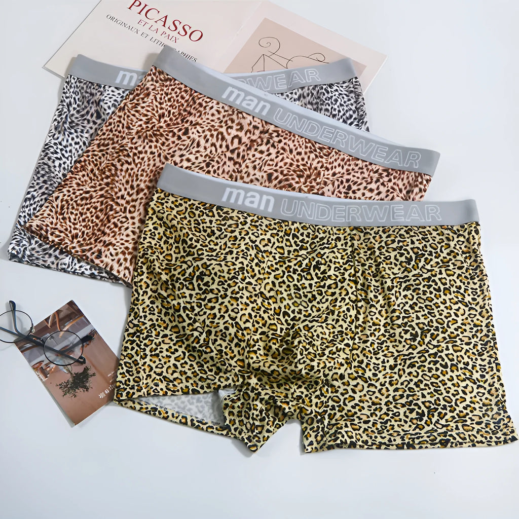 Men's loose leopard print underwear in milk silk polyester fabric showing mid-waist design