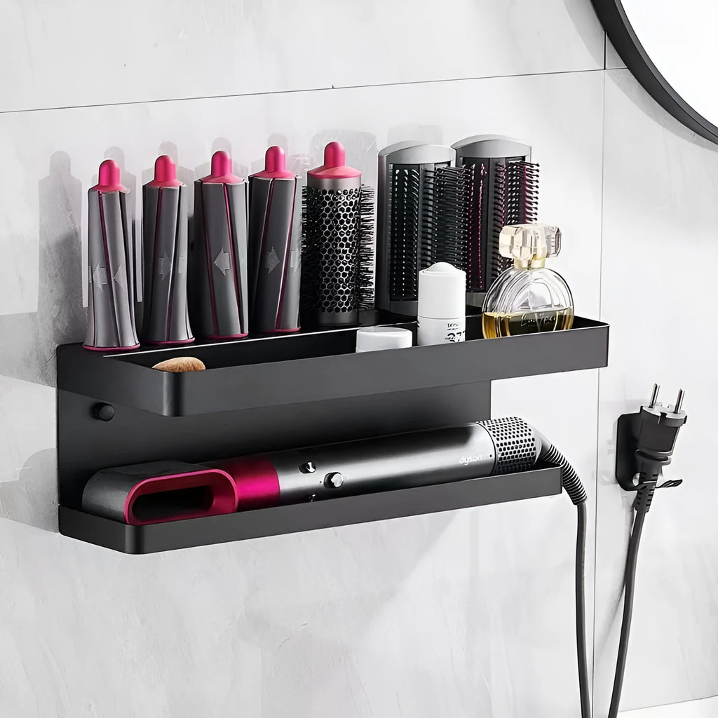 White double-layer aluminium wall rack holding hair curlers, mounted punch-free on a tiled bathroom wall.