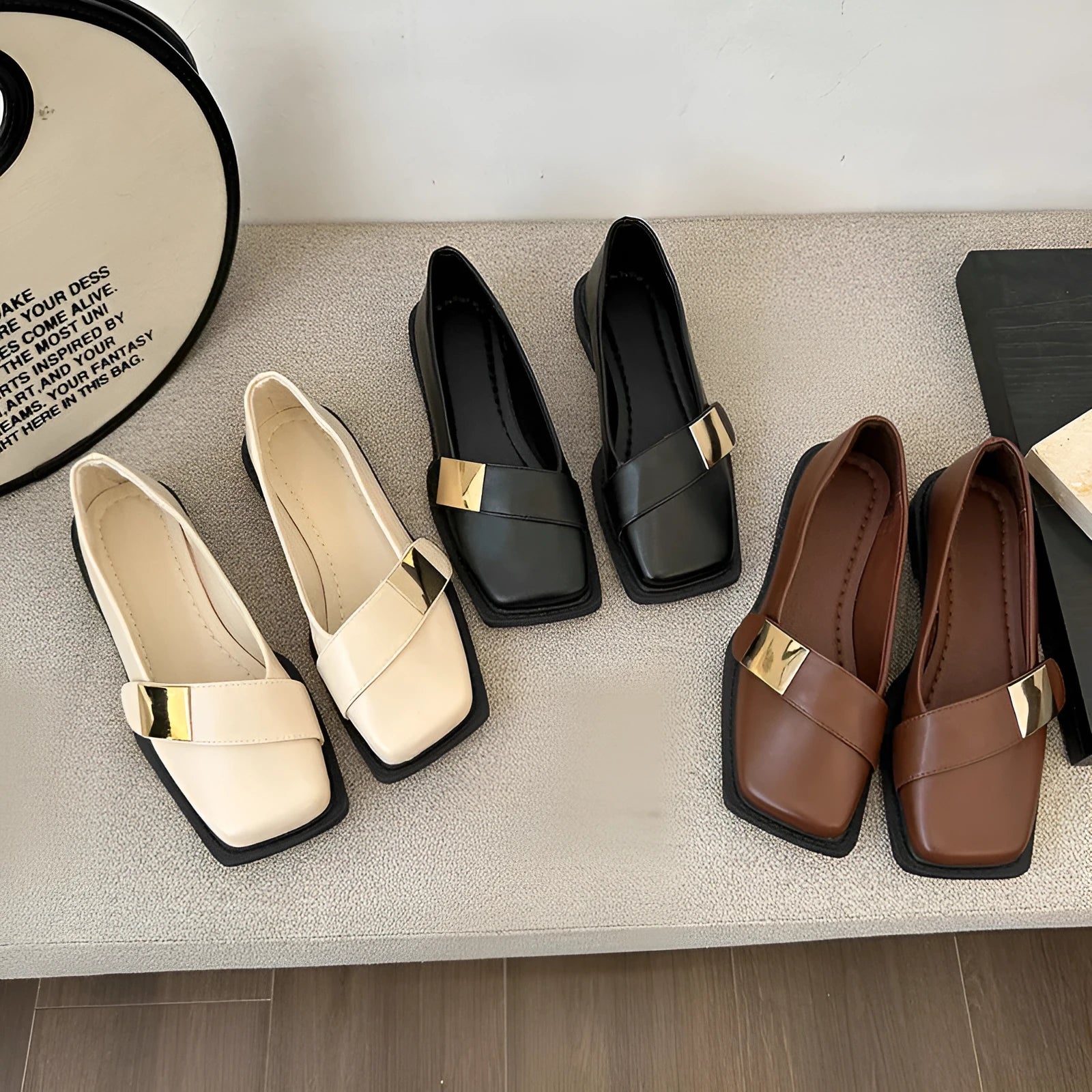 Women's artificial leather flat-heeled shoes with square toe and metal buckle in beige, black, and brown colours