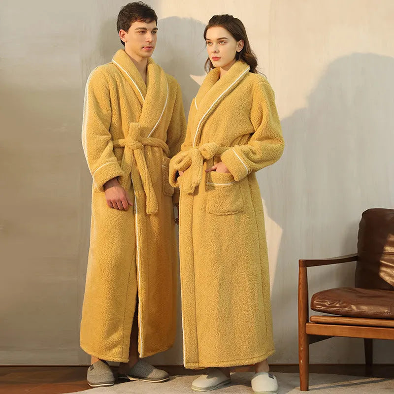 Man and woman wearing matching thick flannel bathrobes in winter colours like navy blue and cherry yellow.
