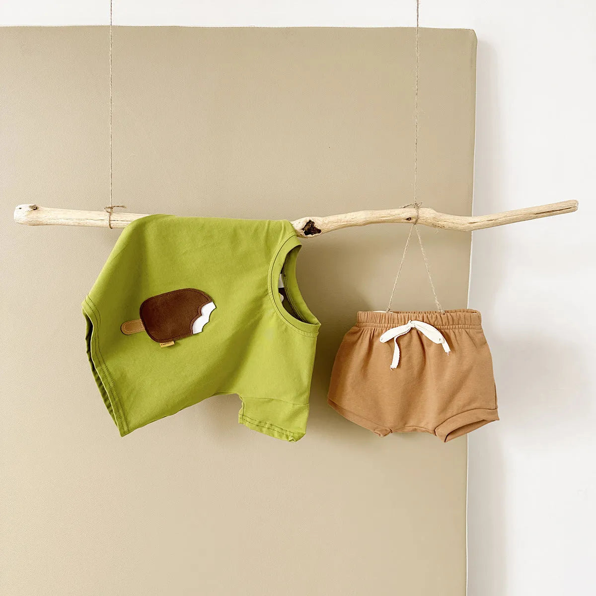 Girls' olive green cotton shorts suit set with ice cream patch detail on short sleeve shirt.