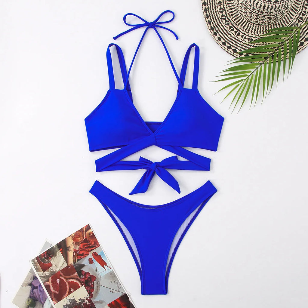 Women's solid colour strap bikini swimsuit in brief style on a white background.