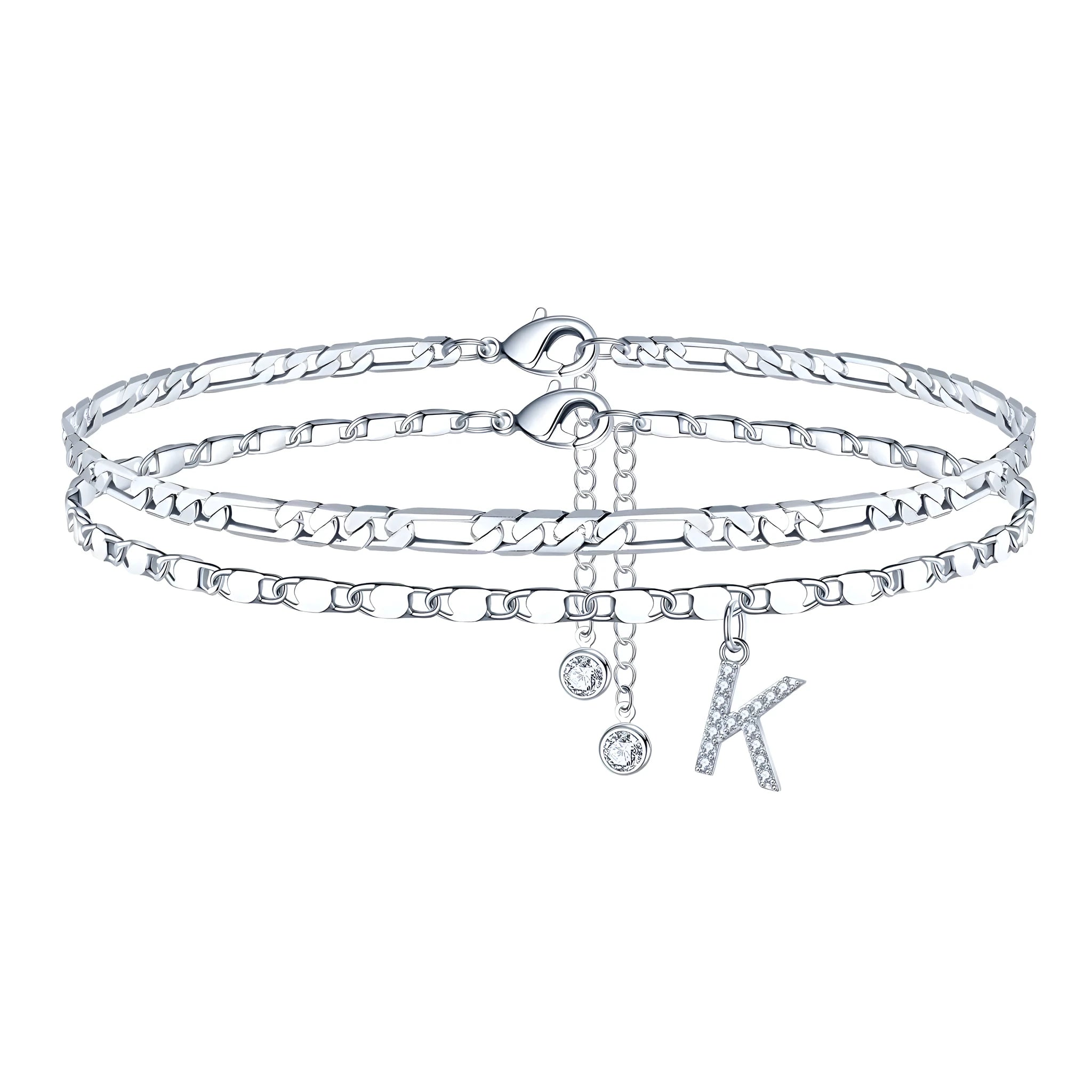 Silver-coloured copper anklet with a double-circle bead engraved with a letter.