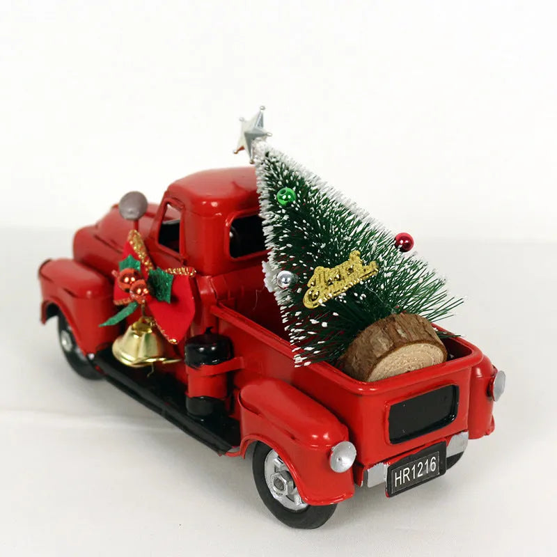 Retro red wrought iron Christmas truck ornament on a white surface, side view showing 17 cm length