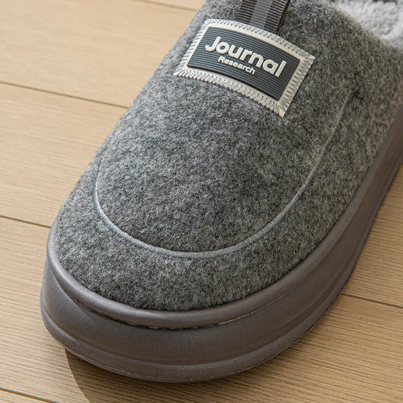 Men's brown and grey suede slippers with a thickened sole, shown from the side.